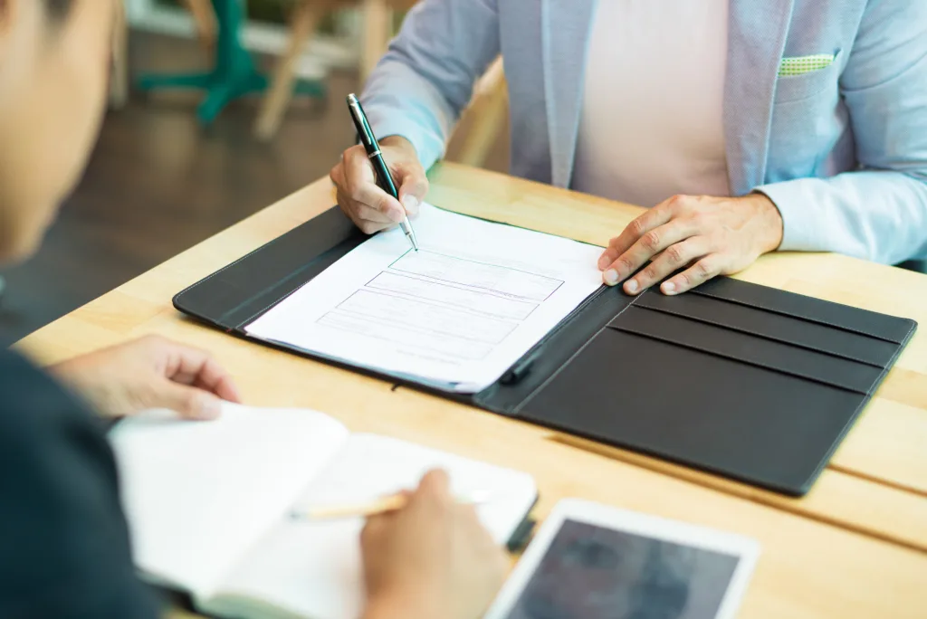 Business professionals completing ASIC company registration paperwork including ABN, ACN, TFN, and initial compliance setup.